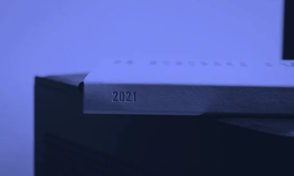 A clean minimalist calendar planner on a desk