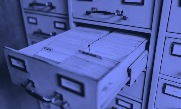 An overflowing filing cabinet showing the chaos of unverified information