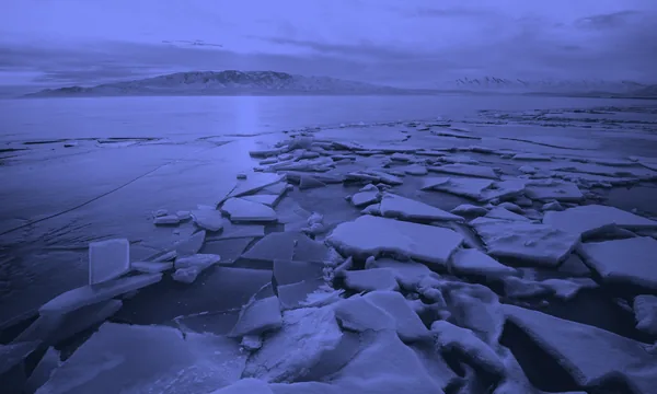 A frozen lake landscape in winter