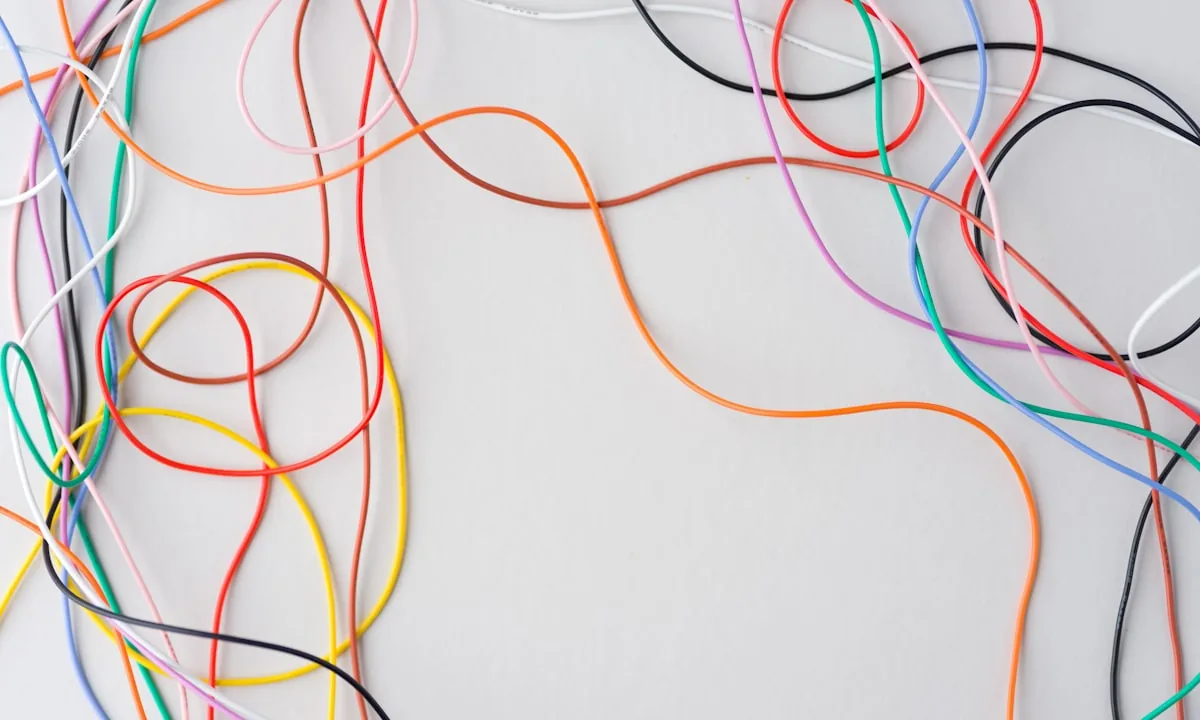 Tangled messy cables representing the fragility of AI interacting with human graphical interfaces