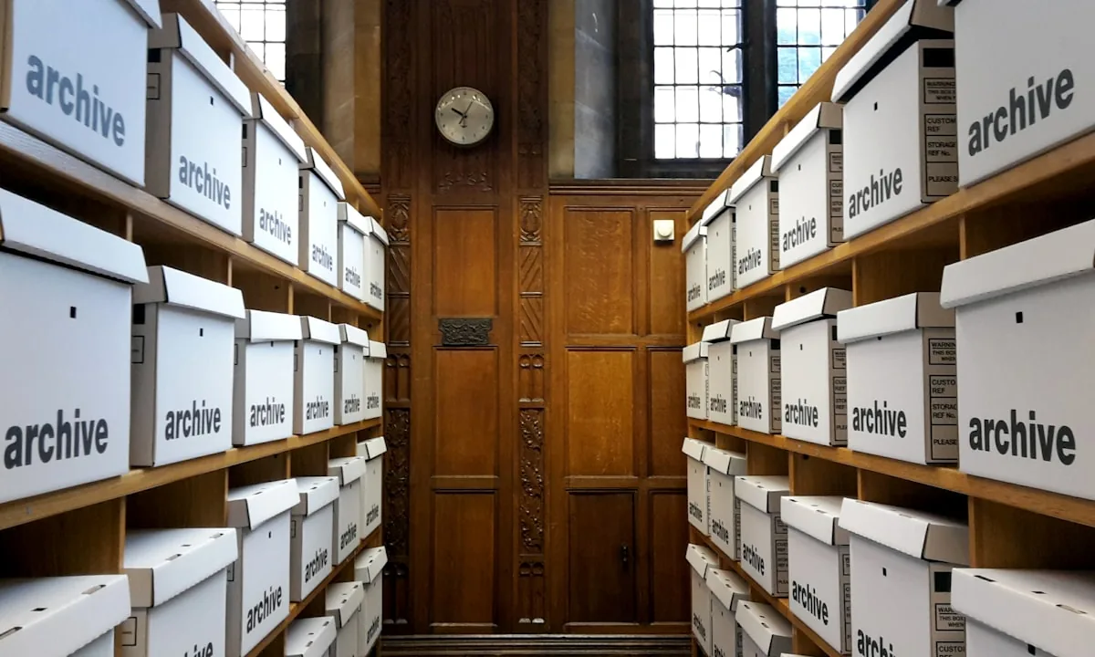 A room full of overflowing archive boxes representing an overcluttered memory