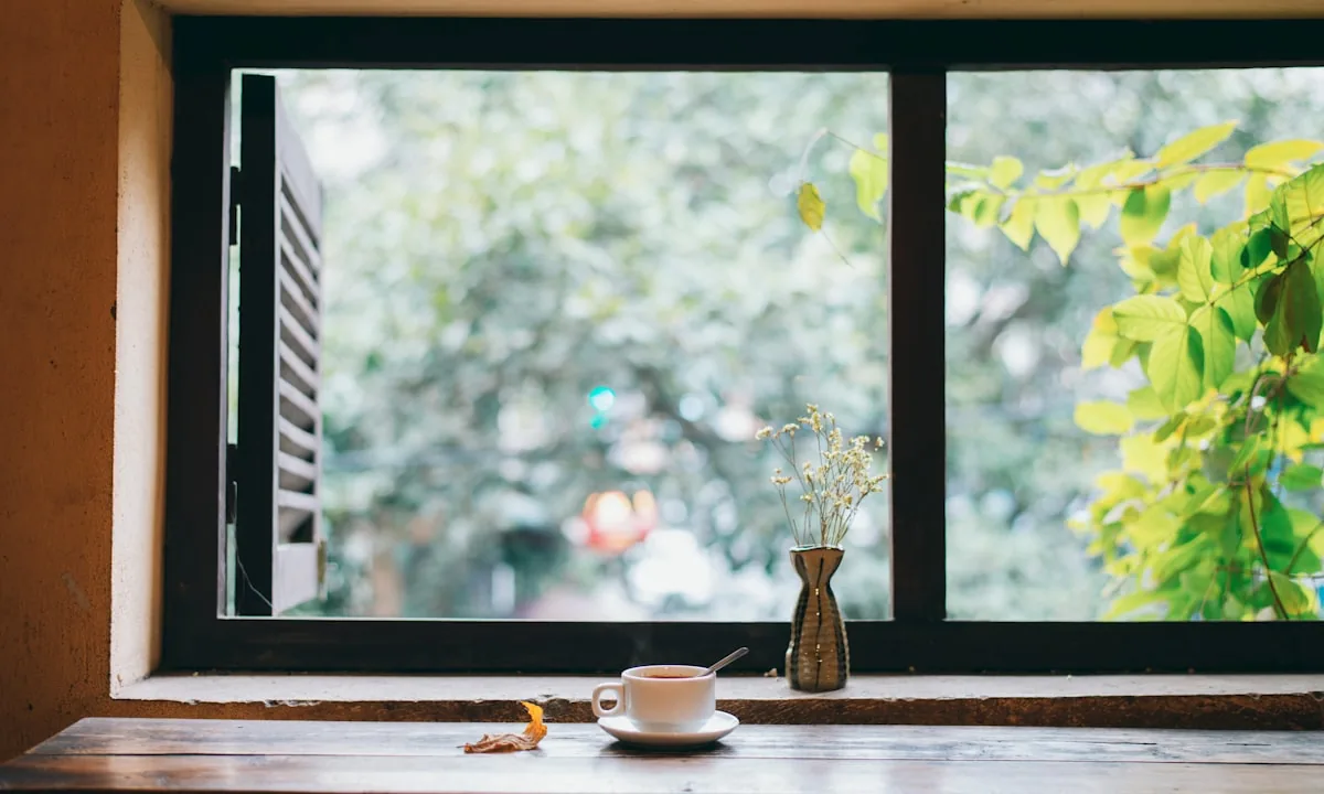 A cup of coffee by the window, symbolizing unplugged moments