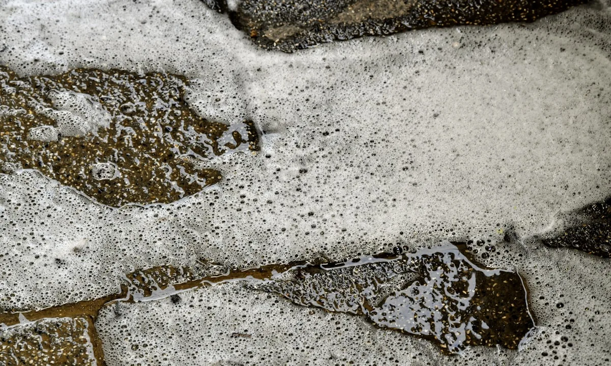 Power washing a dirty floor with water