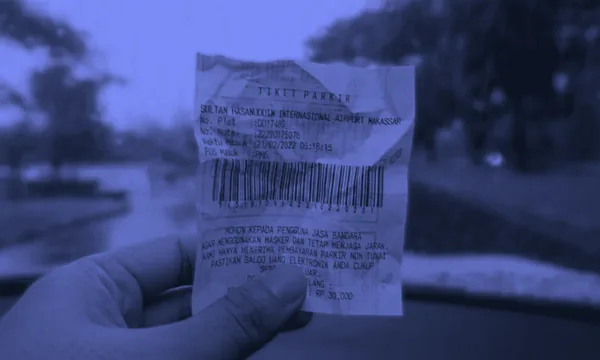 A massively long receipt symbolizing the huge token costs of agent prompts.