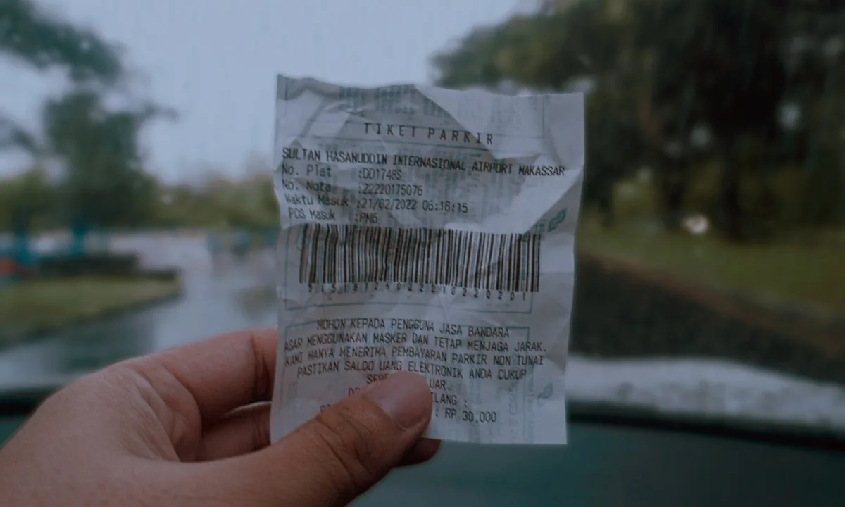 A massively long receipt symbolizing the huge token costs of agent prompts.