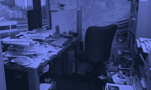 A messy and cluttered desk causing visual confusion