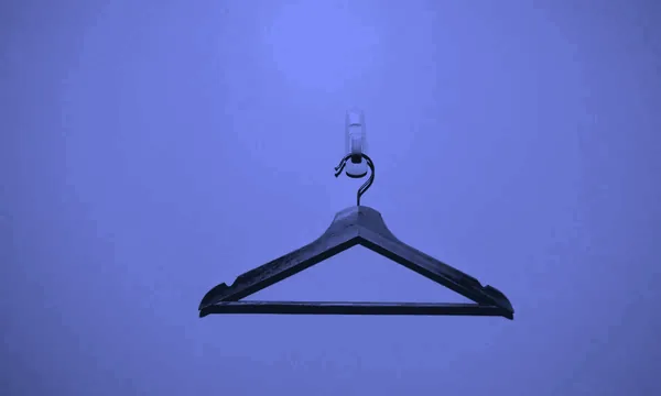 Hanging clothes in a tidy closet