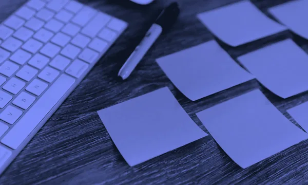A sticky note placed over a computer keyboard
