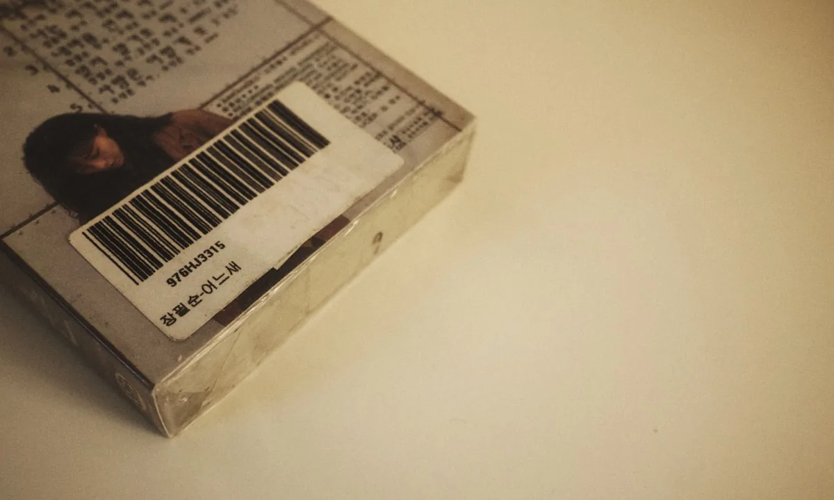 A barcode scanner reading a price tag, symbolizing the cost measurement of digital tokens.