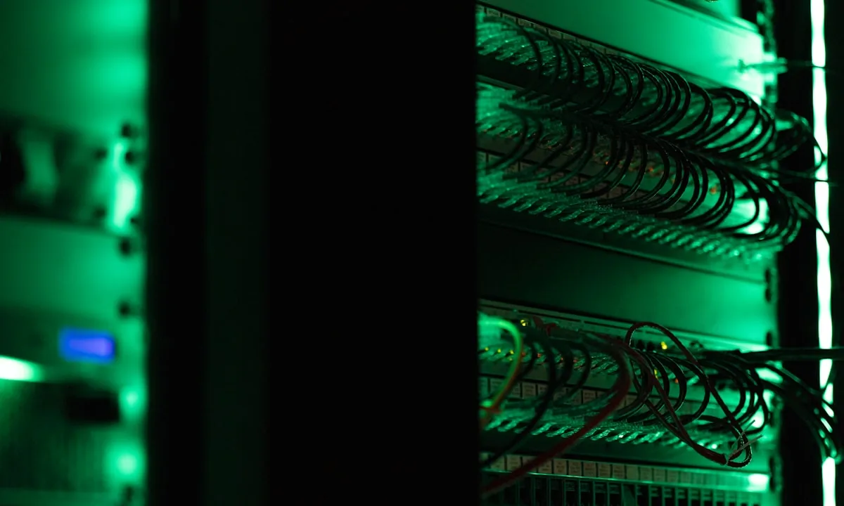 A messy, chaotic wiring system in a server room representing undocumented code