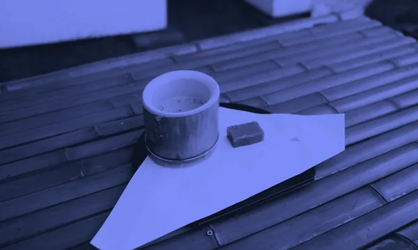 A minimalist bamboo tea set on a clean wooden table symbolizing simplicity and openness