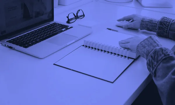 Neat workspace with a notebook focused on grouped tasks
