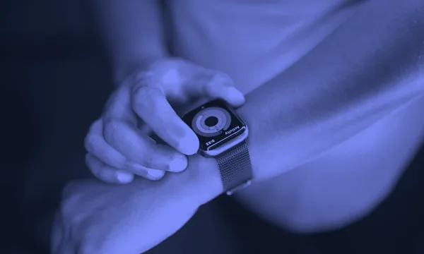 A modern wearable smartwatch displaying health metric interfaces on a wrist.