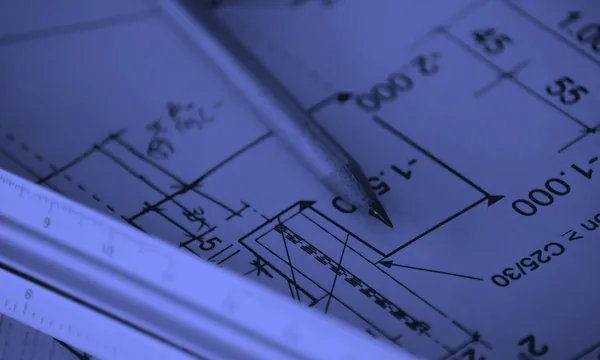 System design blueprint document on a wooden desk