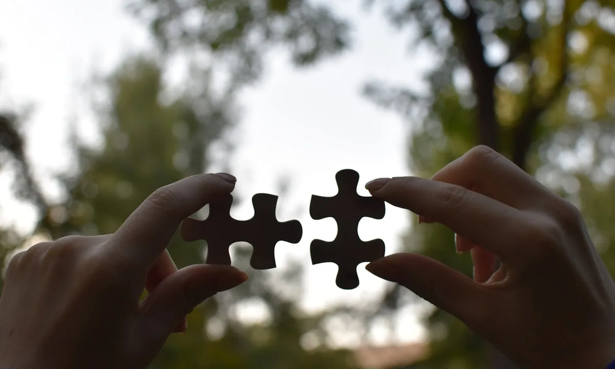A person solving a complex puzzle representing cognitive struggle