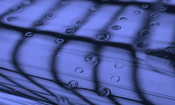 A spherical water droplet levitating over a heated metal surface