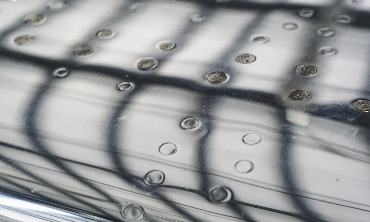 A spherical water droplet levitating over a heated metal surface